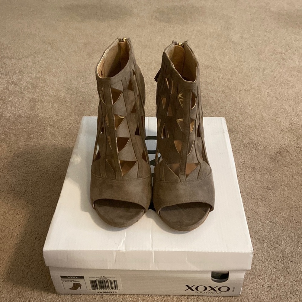XOXO Cutout zip up heeled booties.